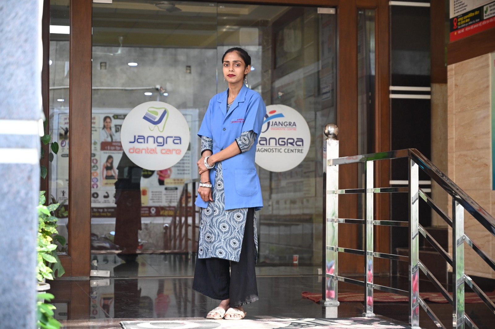 Healthcare assistant at the entrance of Jangra Diagnostic Centre